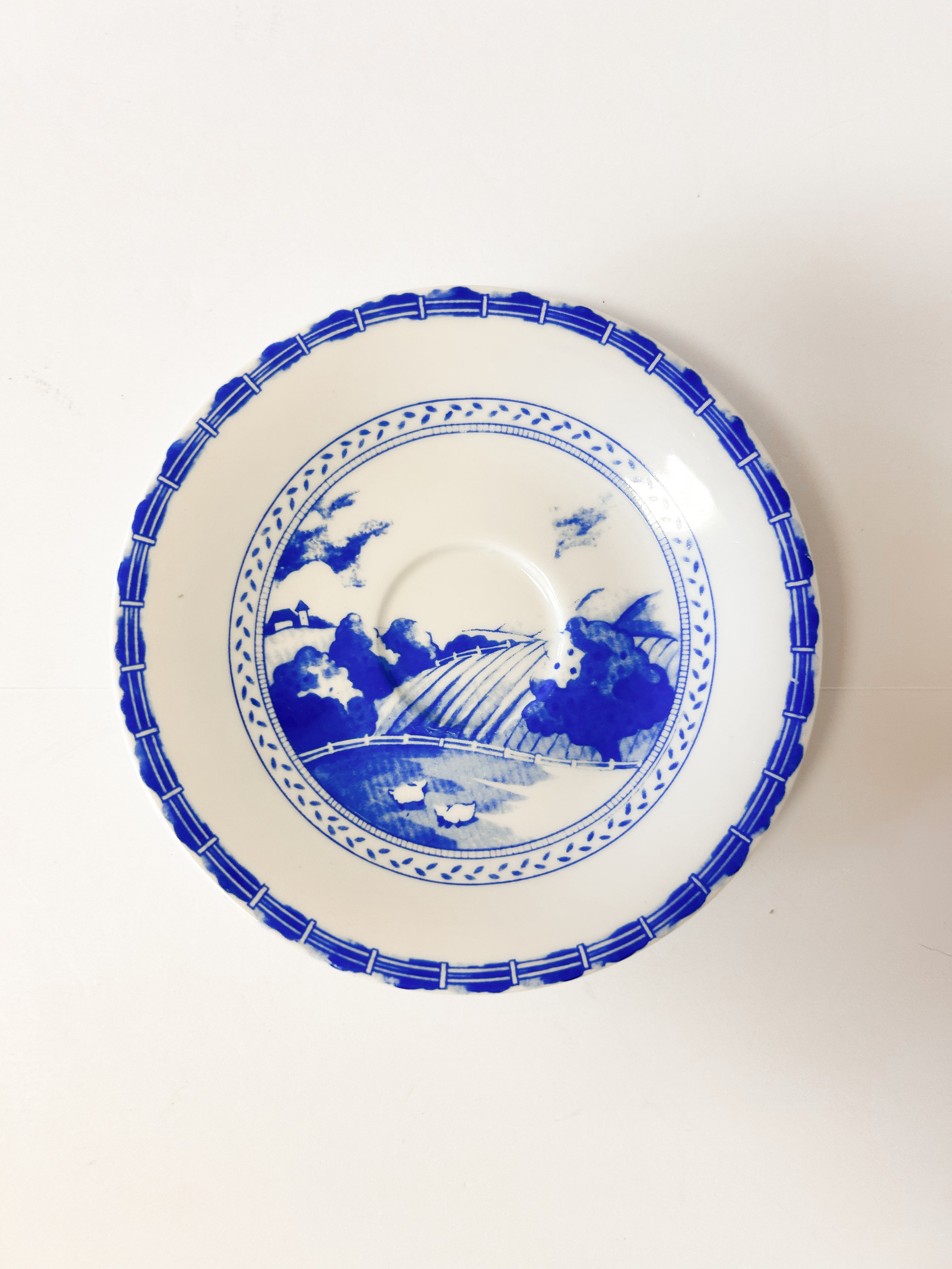 Blue and White Teleflora Saucer